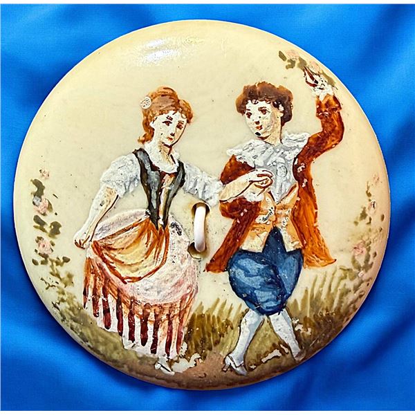 A DIVISION ONE HAND PAINTED FIGURAL BUTTON