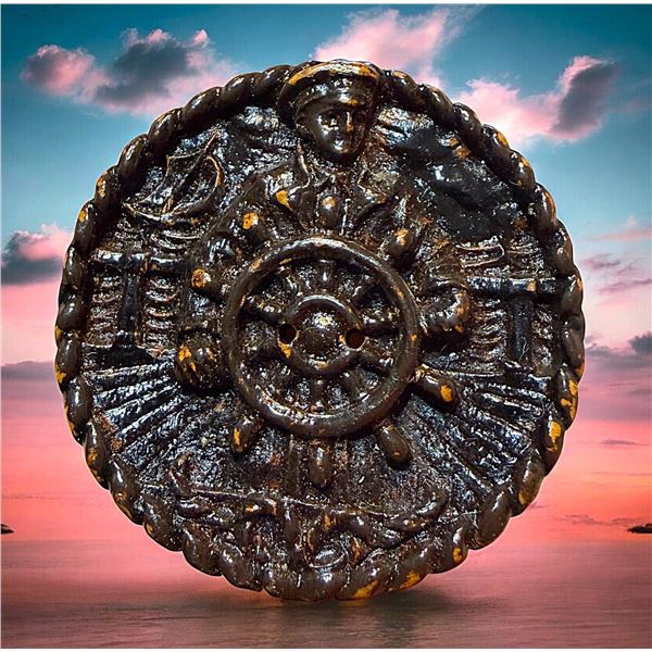 A DIVISION THREE FIGURAL WOOD BIUTTON