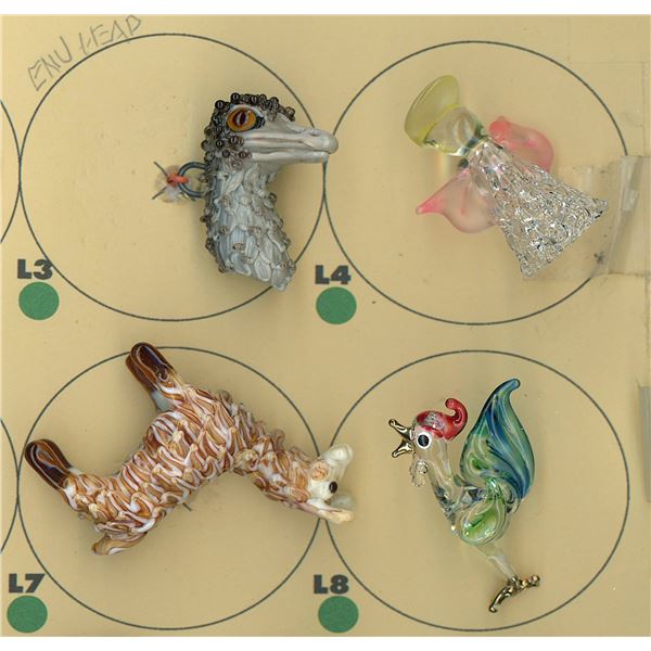 A PARTIAL CARD OF DIVISION THREE GLASS BUTTONS