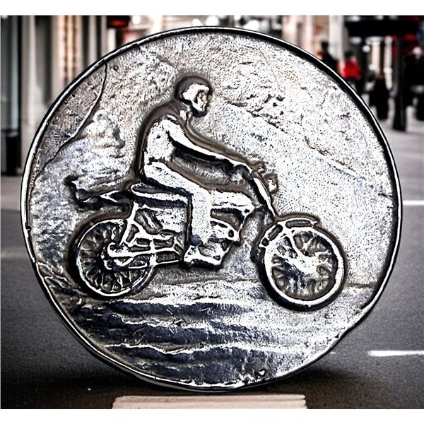 A DIVISION THREE DETAILED MOTORCYCLE BUTTON