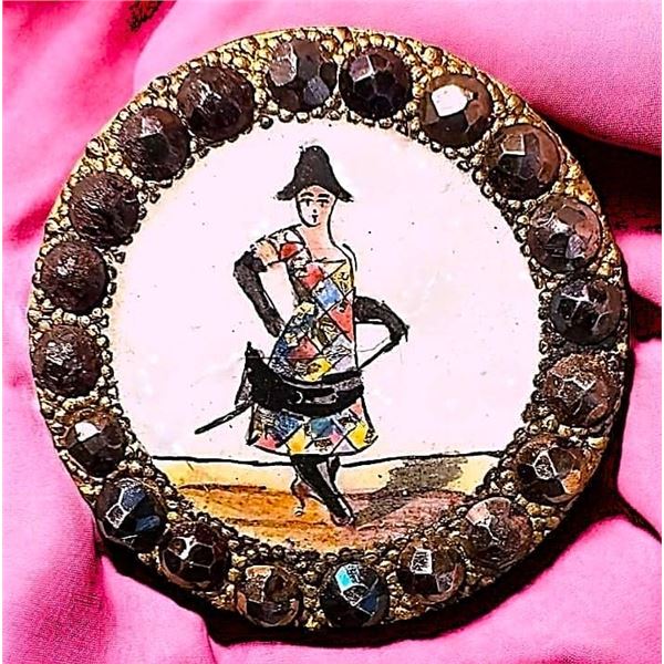 A DIVISION ONE POLYCHROME ENAMEL FIGURAL BUTTON