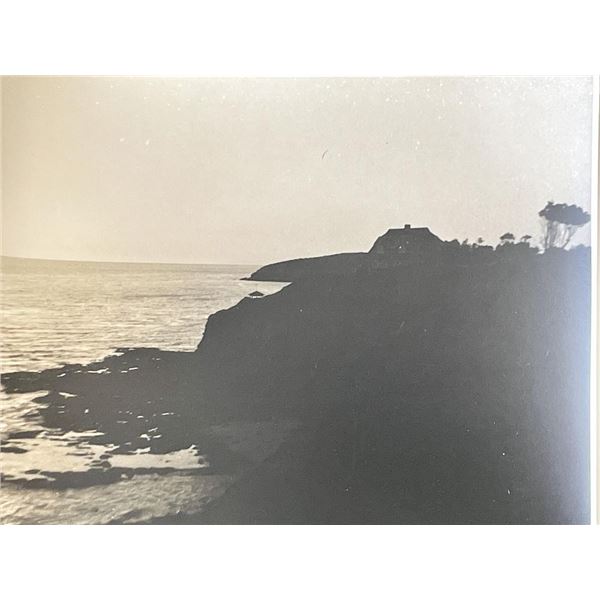 Vintage coastal cliff house photo