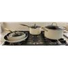 Image 1 : Ceramic Coated Cookware with Gold-Tone Handles and Glass Lids
