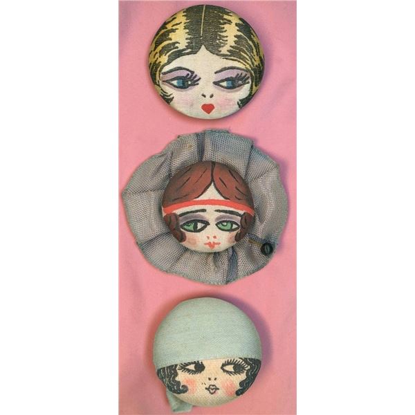 A SMALL CARD OF DIVISION  THREE FABRIC BUTTONS