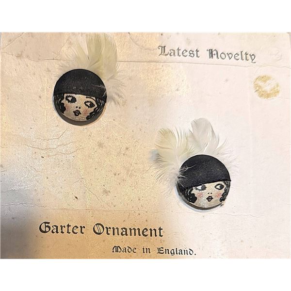 A SMALL CARD OF DIVISION THREE FABRIC BUTTONS