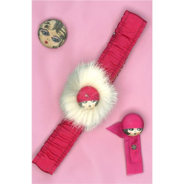 A SMALL CARD OF DIVISION  THREE FABRIC BUTTONS