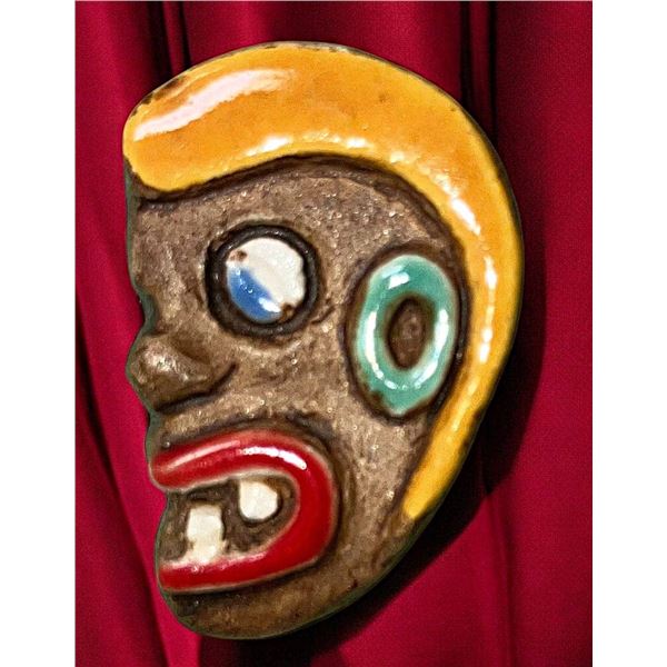 A DIVISION THREE PICTORIAL CERAMIC BUTTOIN