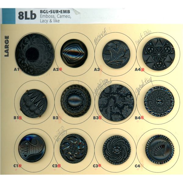 A PARTIAL CARD OF DIVISION ONE BLACK GLASS BUTTONS