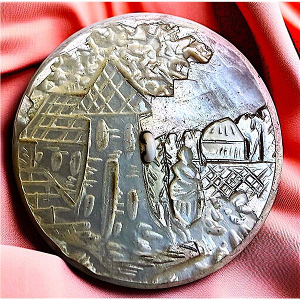 A DIVISION ONE CARVED PEARL SCENE BUTTON