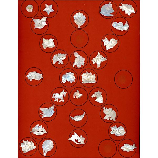 A CARD OF DIVISION ONE CARVED REALISTIC SHELL BUTTONS