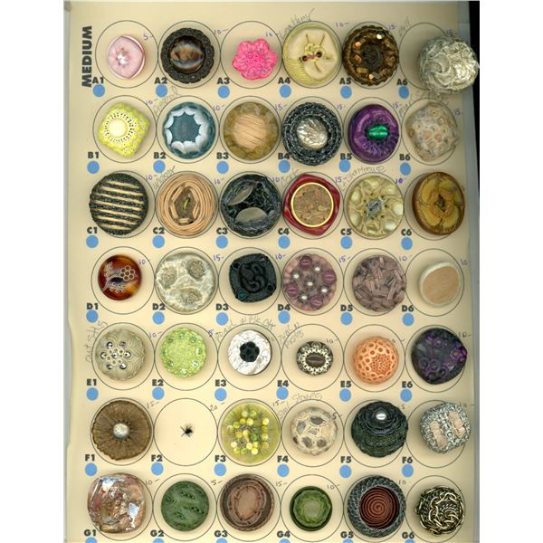 A CARD OF DIVISION THREE COUTURE STUDIO BUTTON