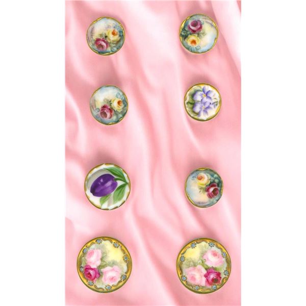 A SMALL CARD OF HAND PAINTED CERAMIC BUTTONS