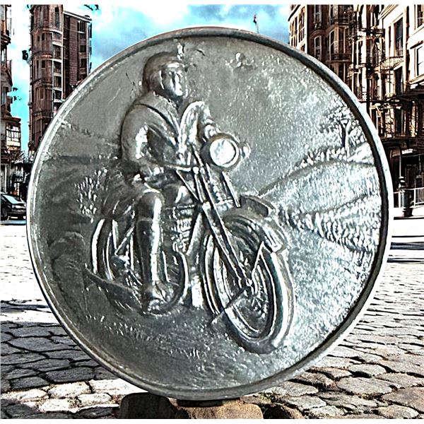 A DIVISION THREE DETAILED MOTORCYCLE BUTTON