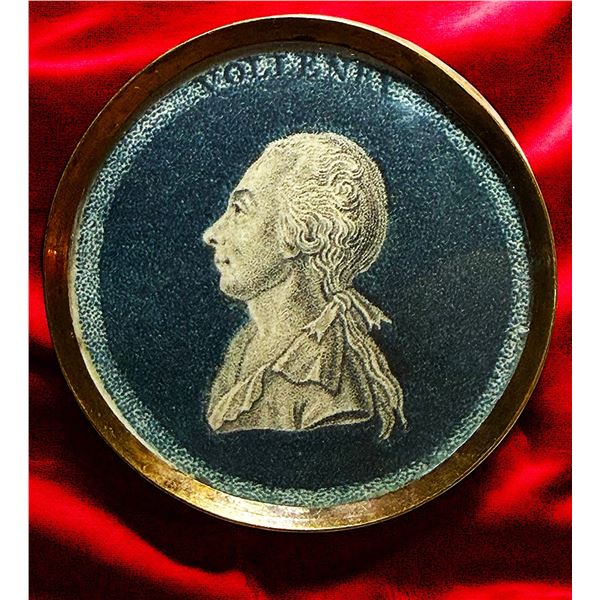 A  DIVISION ONE UNDER GLASS FIGURAL BUTTON