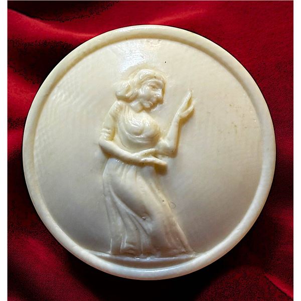 A DIVISION THREE MOTIWALA FIGURAL BUTTON