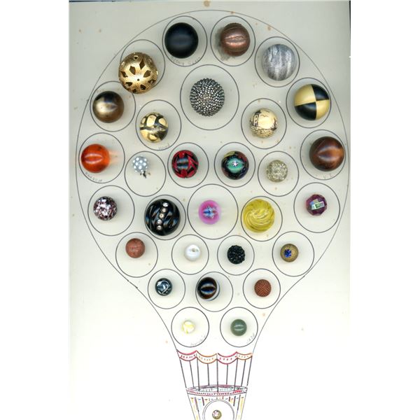 A CARD OF DIVISION ONE AND THREE BALL SHAPED BUTTONS