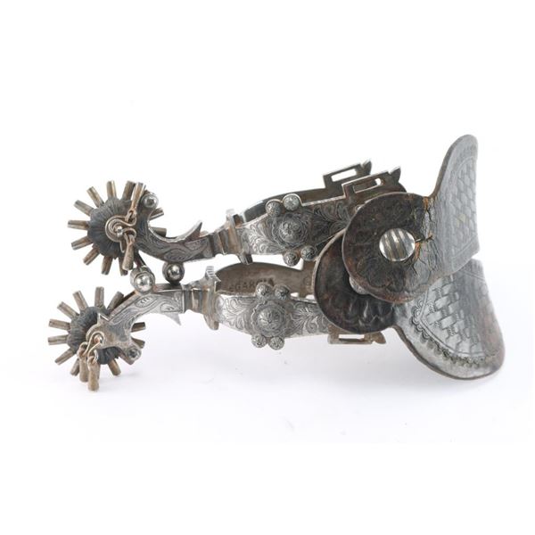 A Pair of E. Garcia Silver Overlay Spurs.