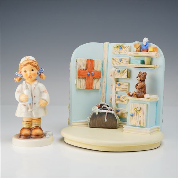 A Pair of Goebel Hummel Figurines Comfort and Care HUM 2075 and Healing Hands Backdrop