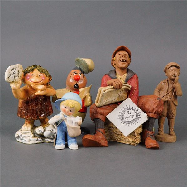 A Group of Five Newspaper Figurines