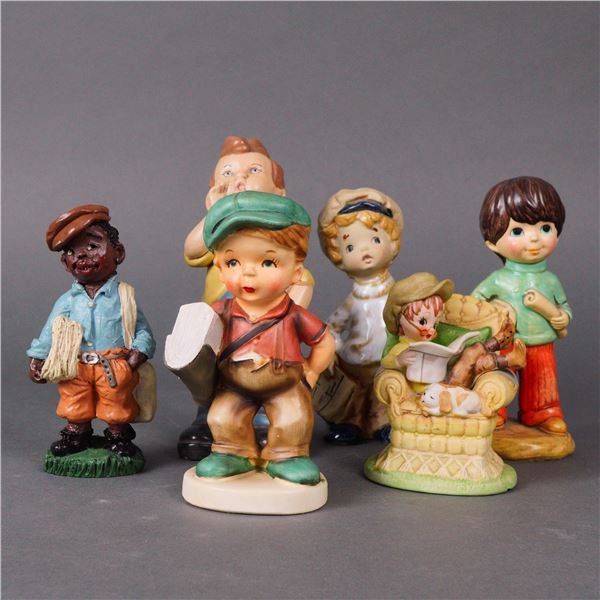 A Collection of Six Glazed Ceramic Newsboys Figurines