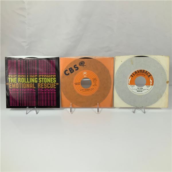 A Trio of Rock 45 RPM Vinyl Records Including The Rolling Stones, Cheap Trick, and Mountain