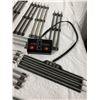Image 6 : VINTAGE TUBULAR 3-RAIL TRACKS TOY TRAIN TRACKS WITH A POWER TRANSFORMER