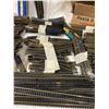 Image 3 : VINTAGE HO SCALE MODEL TRAIN TRACKS AND ACCESSORIES, INCLUDING BRIDGES, STRAIGHT SECTIONS, AND CURVE