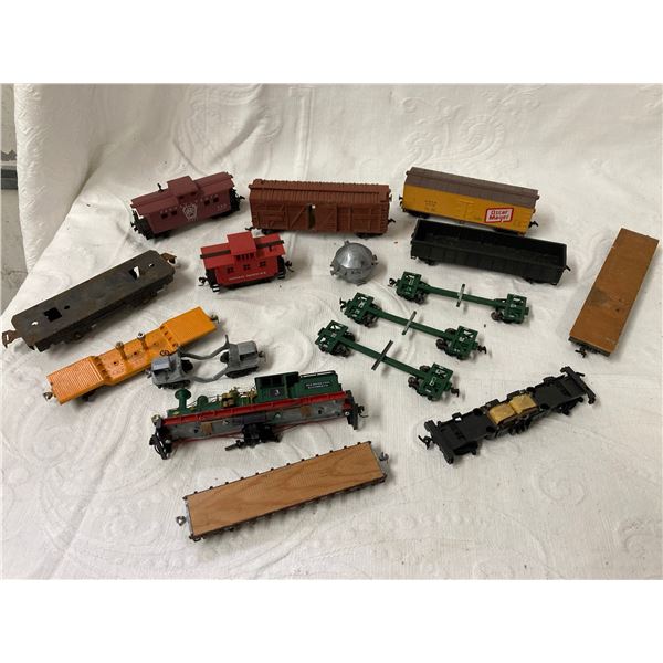 VINTAGE MODEL TRAIN CARS, PARTS, AND A LOCOMOTIVE