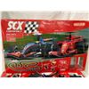 Image 2 : SCX COMPACT 1:43 SCALE SLOT CAR RACING SET, SPECIFICALLY FEATURING FORMULA 1 CARS