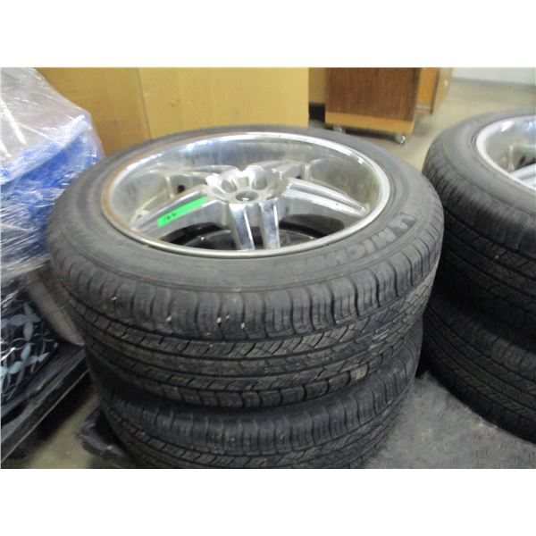 4 - MICHELIN P245-50R20 TIRES (90% TREAD LEFT) ON 4 - 5 BOLT HOLE ALUMINUM RIMS
