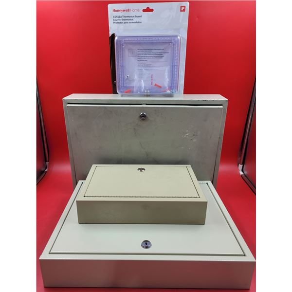 3 metal safes and a honeywell home thermostat guard