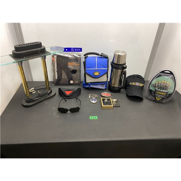Lot of assorted items including table lamp, sun glasses with case, video hook up cable set, coffee t