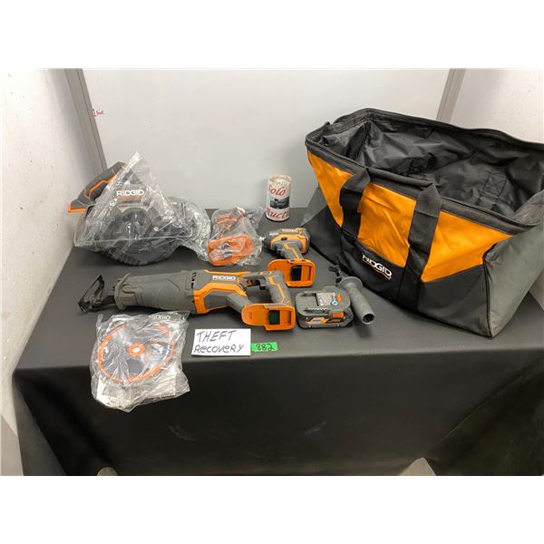 Set of Ridgid brand cordless power tools with batteries and carrying bag