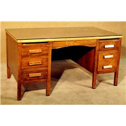 Glass top 7-drawer desk.  Circa 1940s.