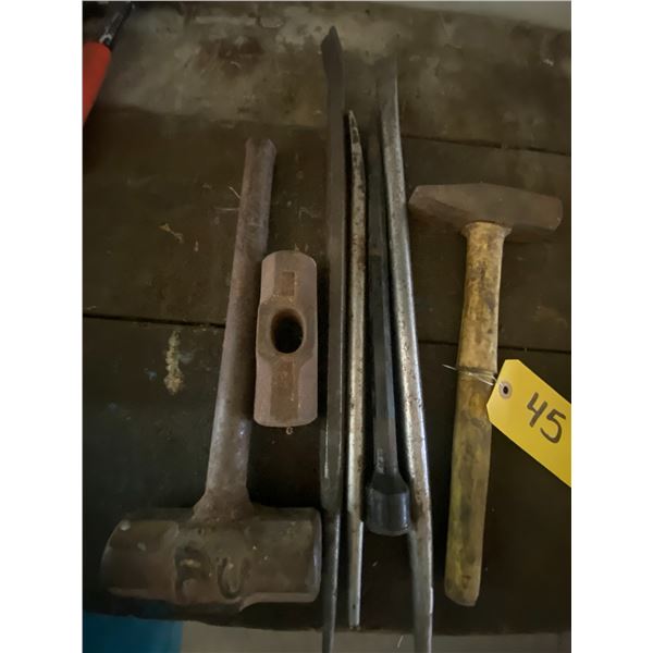 Approx 3 pry bars, and 2 sledge hammers.