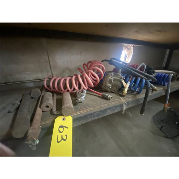 Assortment of misc. air hoses ( different), reflectors, and roll of parachute cord. On lower shelf.