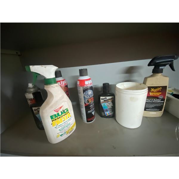 Various shop supplies, gloves, vinyl cleaner etc. On shelf.