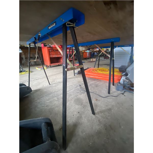 3 metal fold up sawhorses.