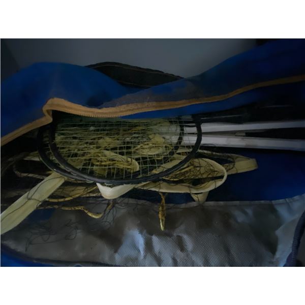 Bag of badminton equipment, and wide load sign.