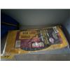 Image 2 : Bag of badminton equipment, and wide load sign.