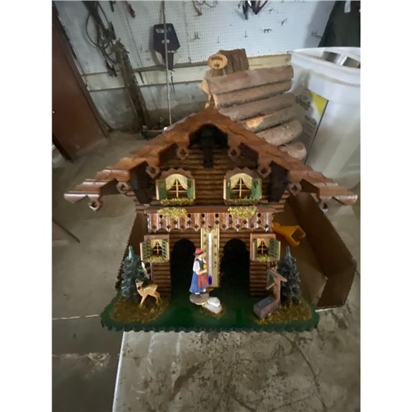 Box of wooden houses, and various toys.