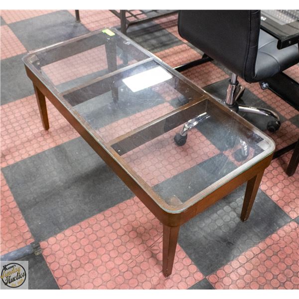 GLASS TOP COFFEE TABLE 43” X 20”