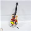 Image 1 : BRITISH FLAG GUITAR COIN BANK WITH STAND