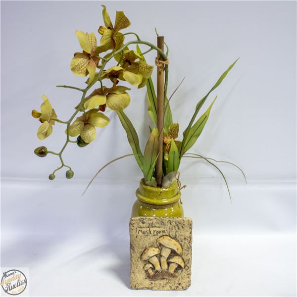LIGHT GREEN ORCHID IN A TALL GREEN VASE
