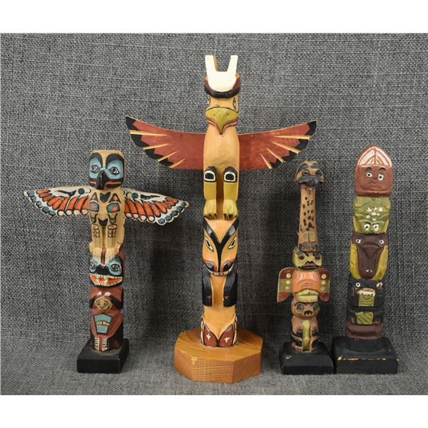 FOUR DECORATIVE TOTEM POLES