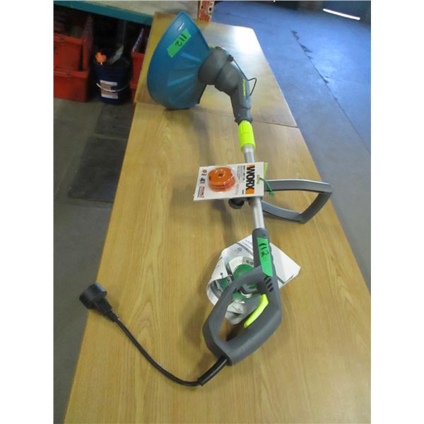 LIKE NEW:  YARD WORKS GRASS TRIMMER WITH EXTRA CORD