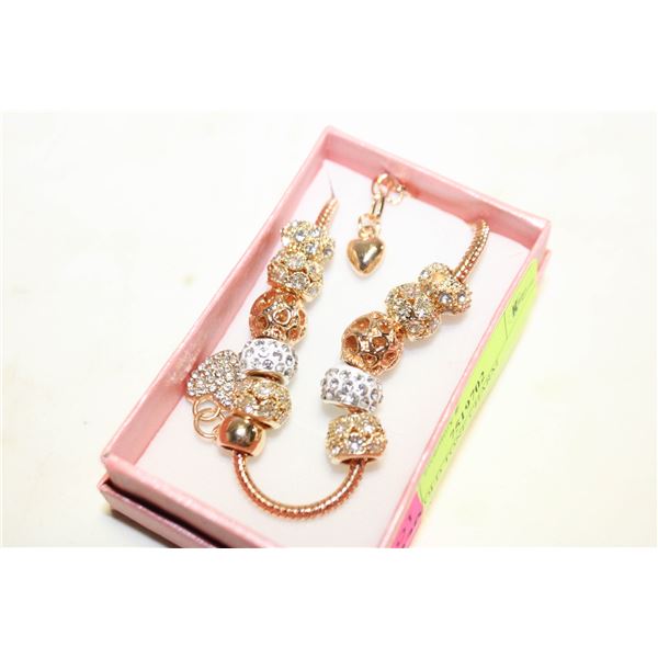 NEW GOLD TONE CHARM BRACELET,