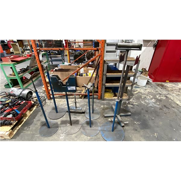 GROUP OF 8 ASSORTED MATERIAL ROLLERS & PIPE STANDS