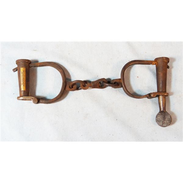 Vintage handcuffs with key