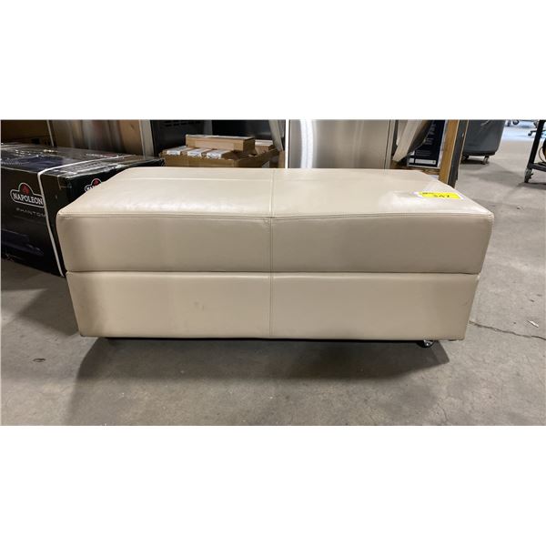 DECOR-REST MODEL 3285 CREAM LEATHER ROLLING STORAGE OTTOMAN